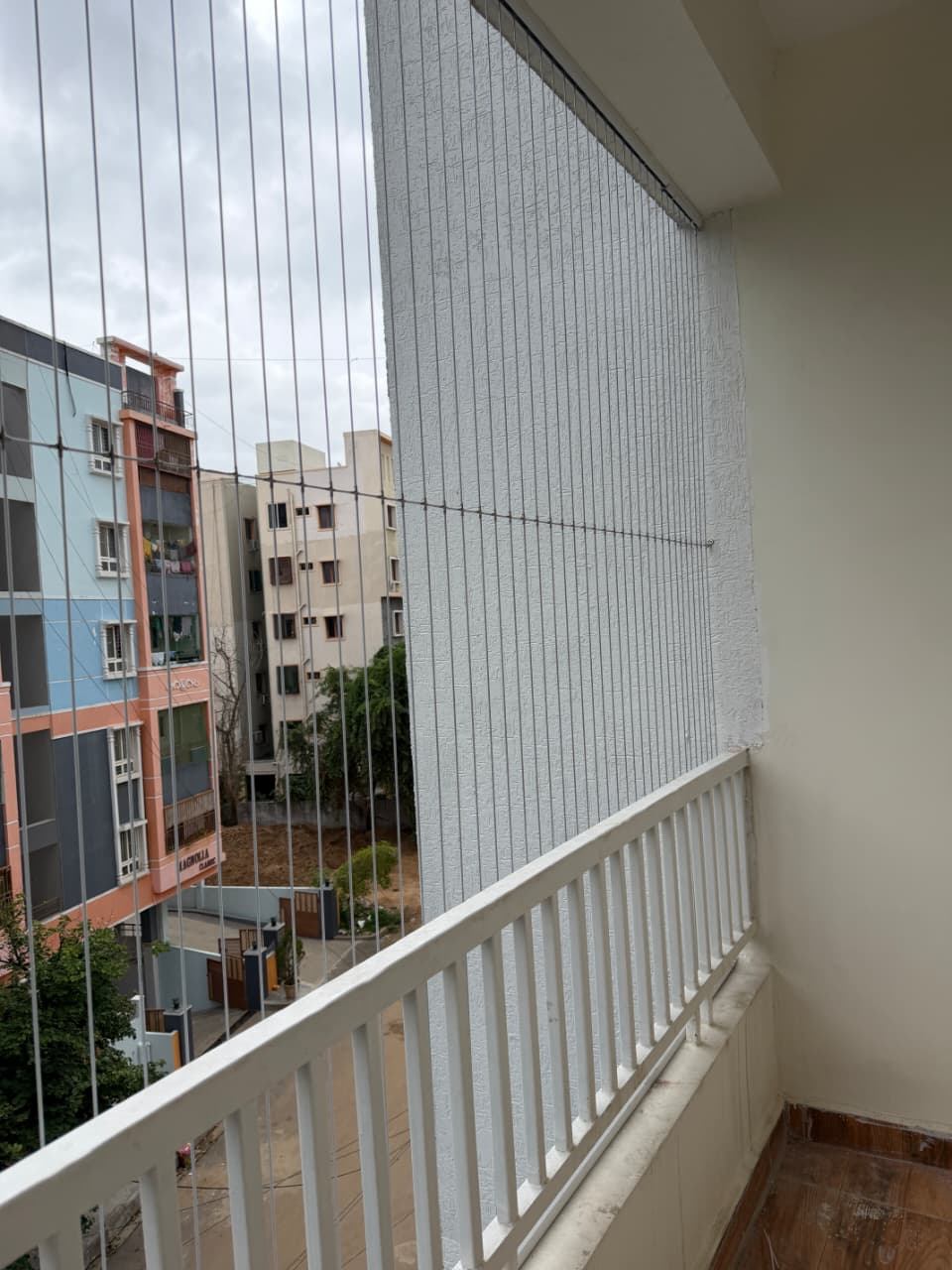 Invisible grill installed on a narrow apartment balcony