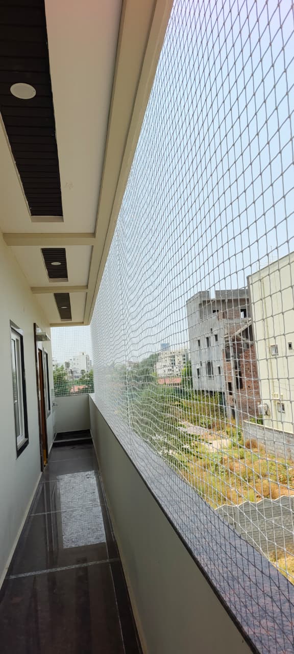 Balcony safety net installed on an apartment balcony